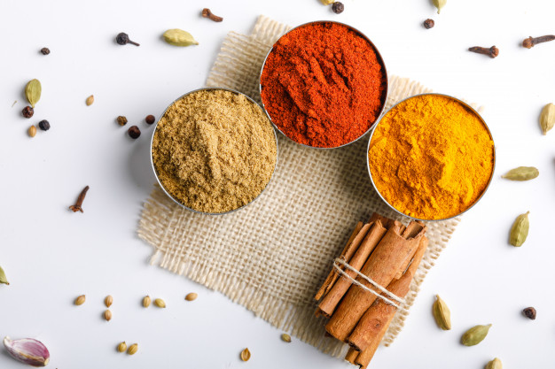 indian-colourful-spices-red-chilli-powder-turmeric-powder-coriander-powder-white-table_96696-236